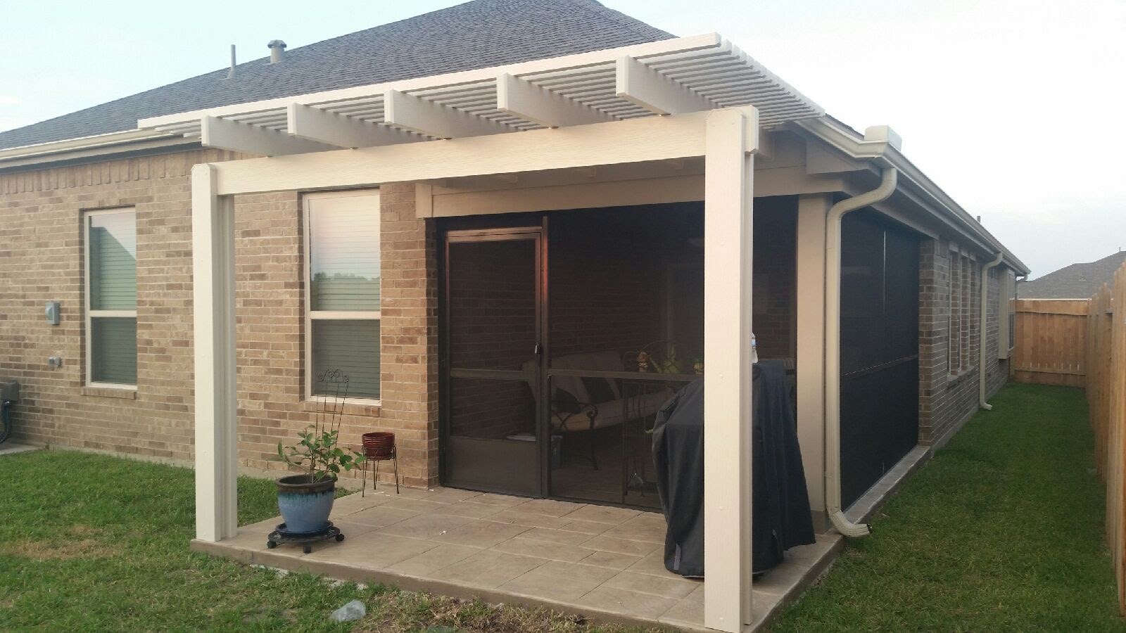 Evening view of a custom backyard pergola