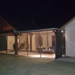 Bronze Patio Cover Screen room in Bronze at night houston, TX