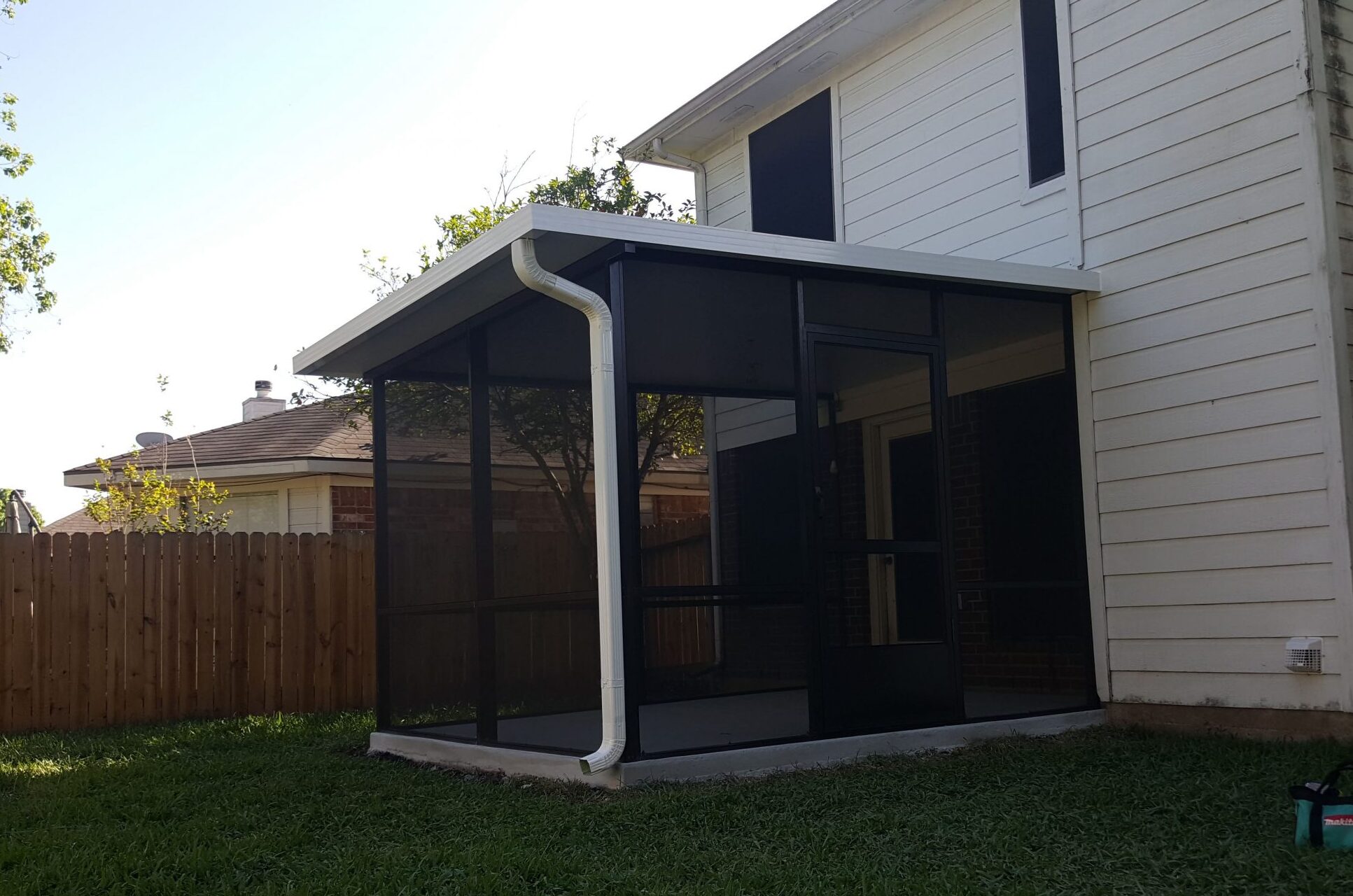 Patio cover with screen room addition in Texas
