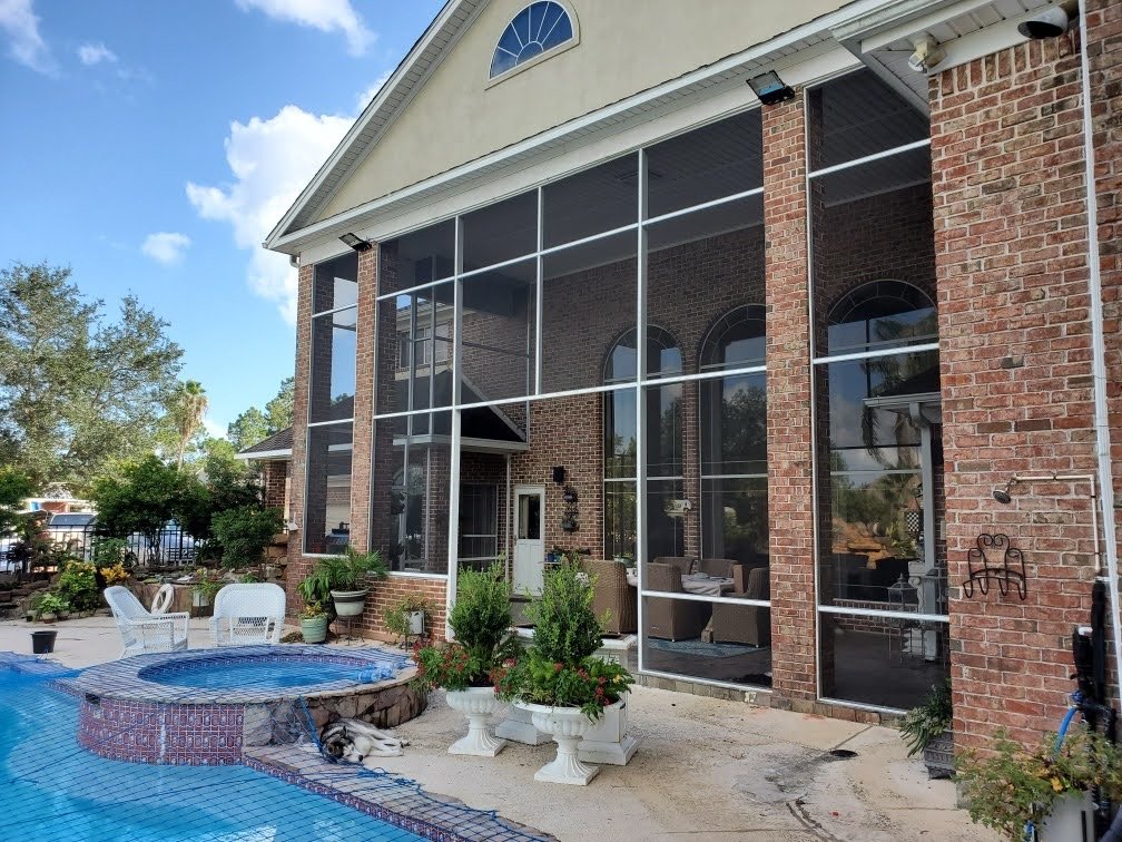 Screened patio enclosure with aluminum framing in Greater Houston Texas
