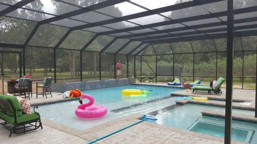 Interior view of a screened pool enclosure in Alvin, TX