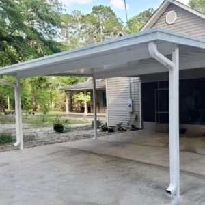 Aluminum carport cover protecting vehicle from Texas sun