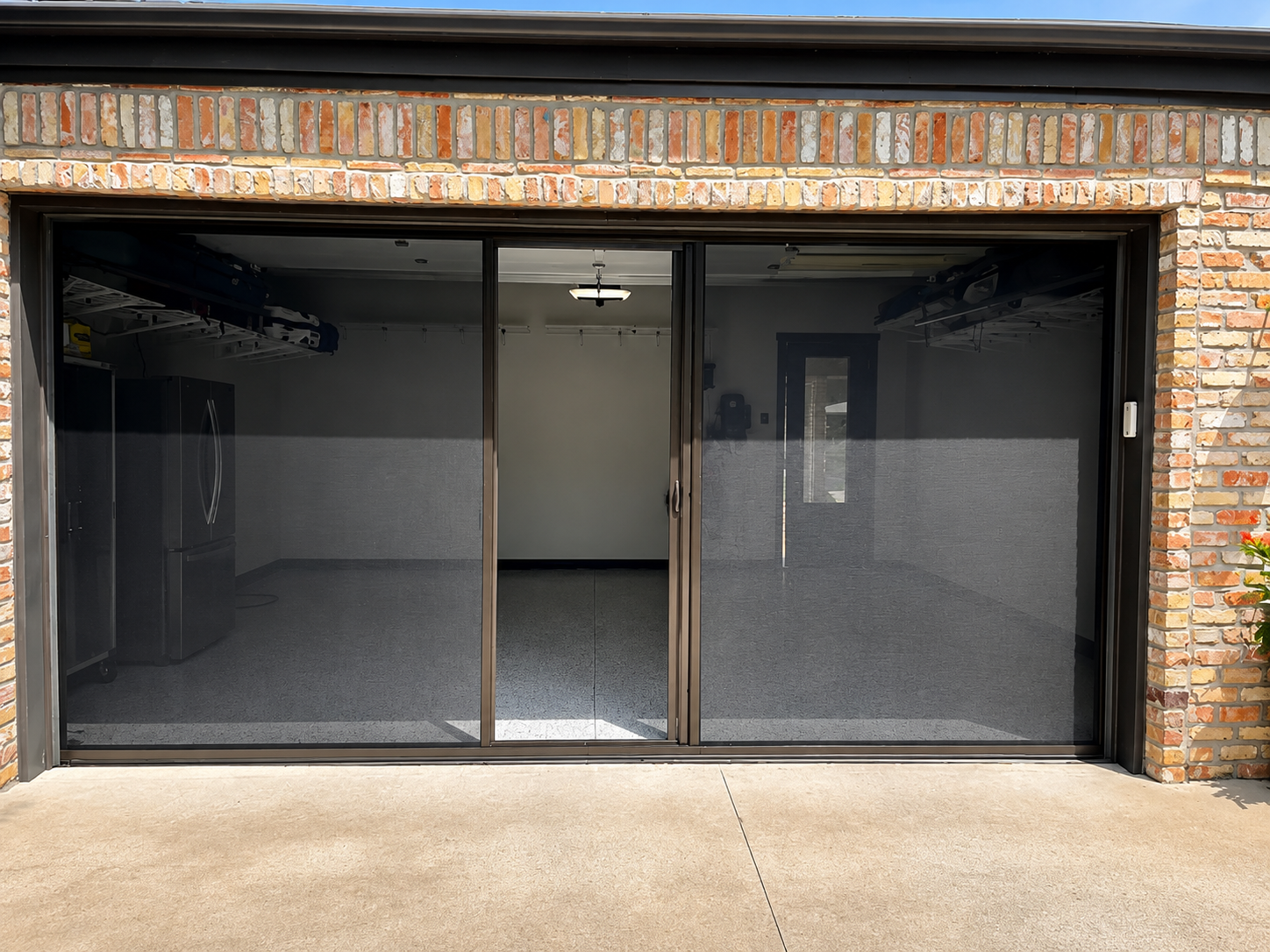 Retractable garage screen installed on a Tomball TX garage workshop