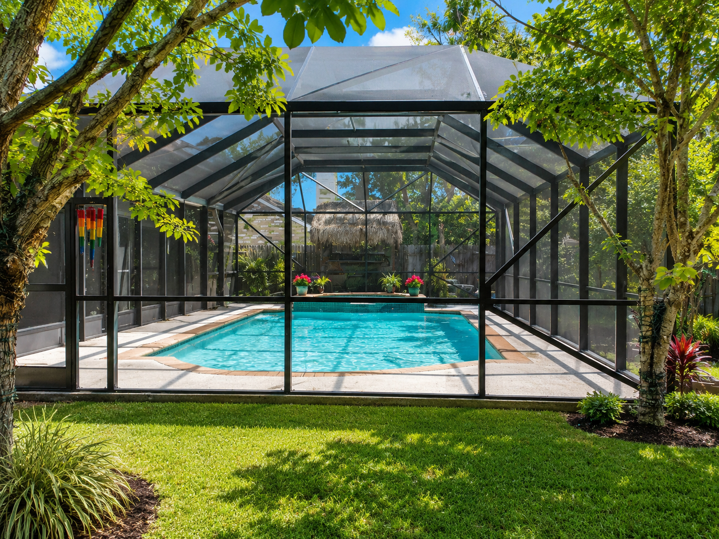 Custom pool enclosure roofline tied into a home by Simmons Home Design