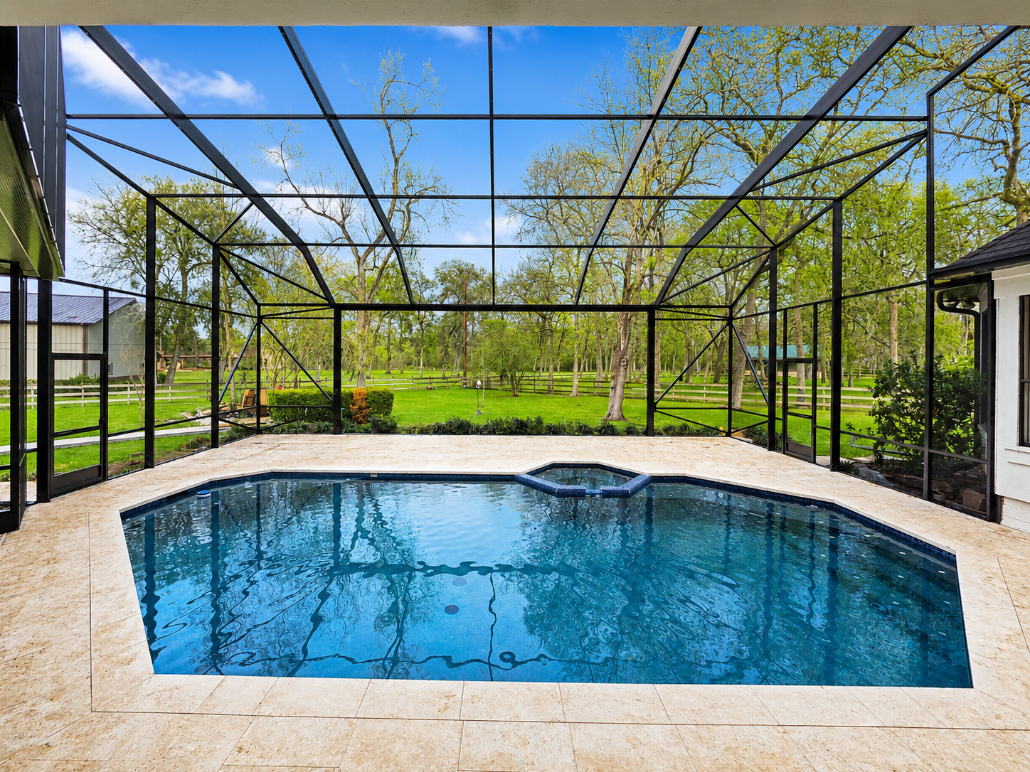 Open-view pool enclosure for a wooded backyard