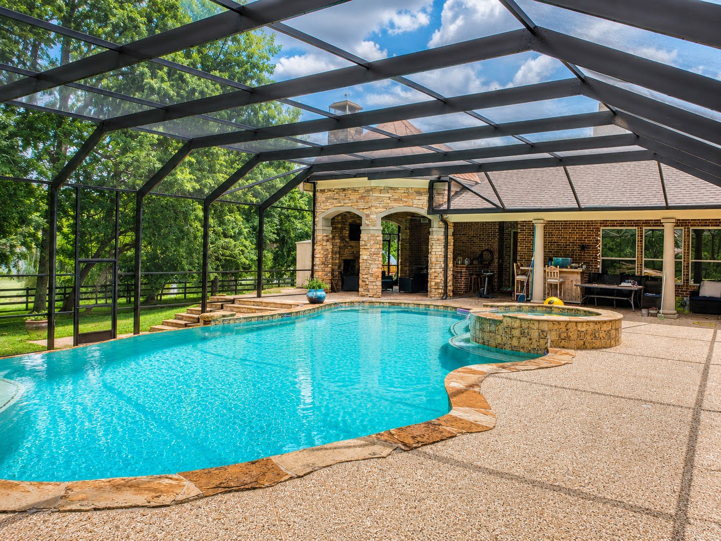 Custom aluminum pool enclosure built by Simmons Home Design near Clear Lake