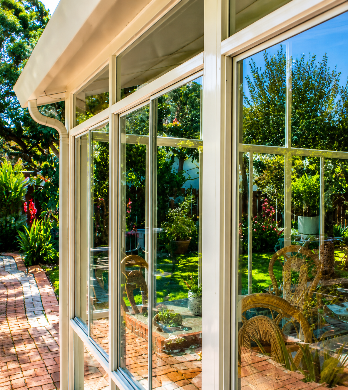 Garden patio with glass enclosure planning near Tomball Texas