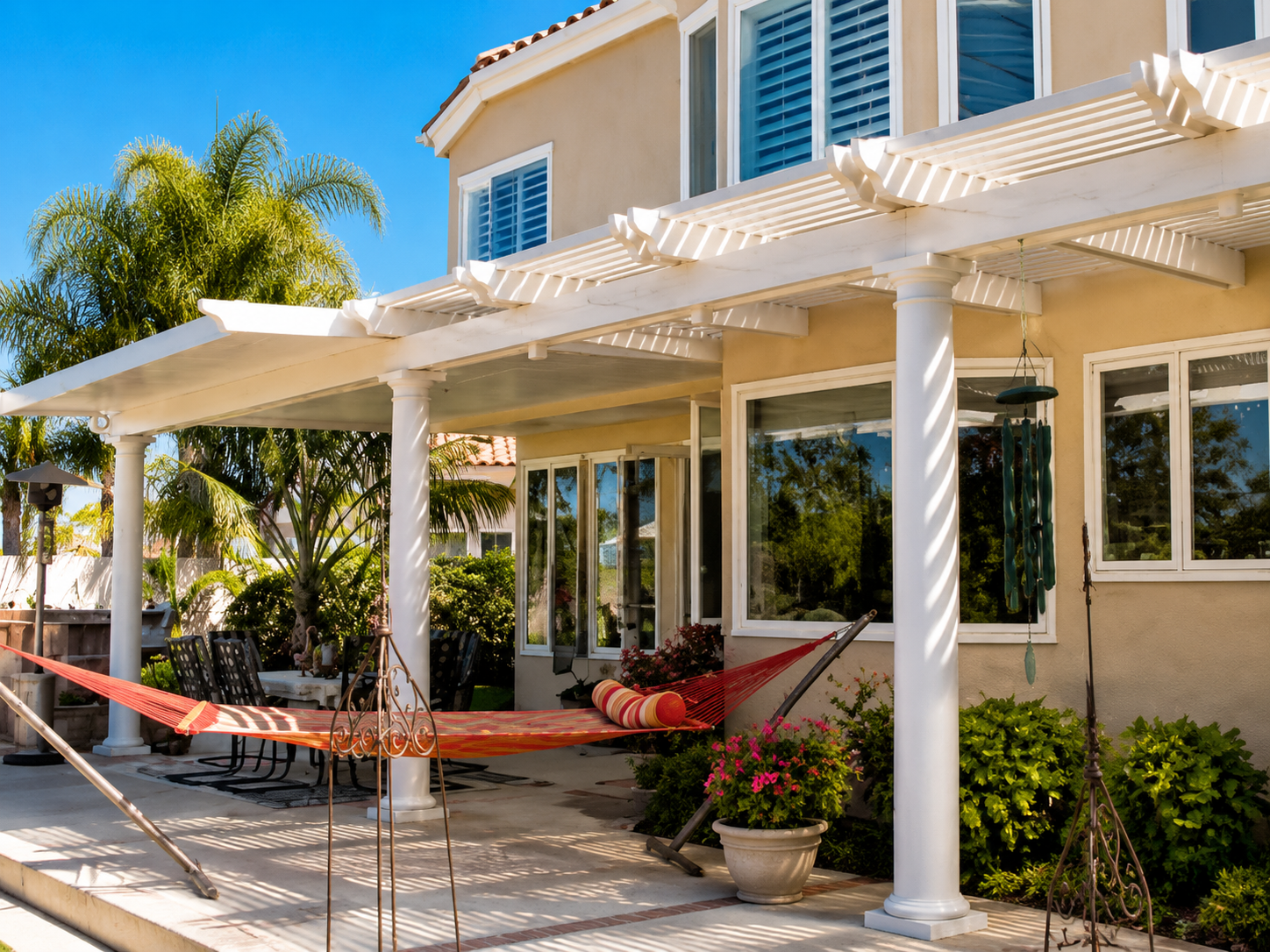 Tropical backyard patio retreat with covered shade near Clear Lake Texas